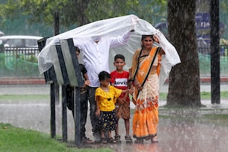 People enjoying rain at Kartavya Path on June 29, 2024 in New Delhi, India. Image: Sonu Mehta/Hindustan Times via Getty Images