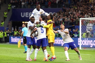 France"s players celebrate after winning the UEFA Euro 2024 quarter-final football match between Portugal and France at the Volksparkstadion in Hamburg on July 5, 2024.
