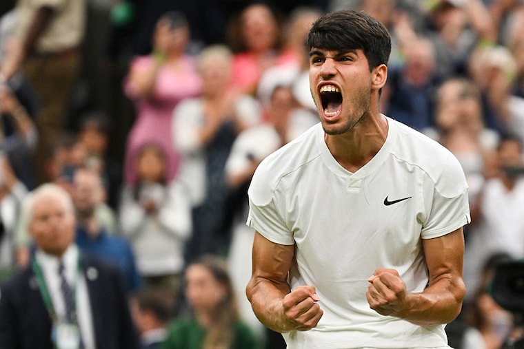 Spain"s Carlos Alcaraz celebrates winning against US player Frances Tiafoe during their men"s singles tennis match on the fifth day of the 2024 Wimbledon Championships at The All England Lawn Tennis and Croquet Club in Wimbledon, southwest London, on July 5, 2024.