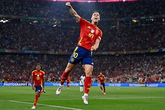 Spain"s forward Daniel Olmo celebrates France"s own goal, scored by Jules Kounde, and Spain"s second goal following his kick during the UEFA Euro 2024 semi-final football match between Spain and France at the Munich Football Arena in Munich on July 9, 2024. Spain advance to the finals after registering a 2-1 win over France.
