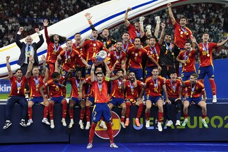 Spain"s Alvaro Morata lifts the Henri Delaunay Cup with teammates following victory against England after the UEFA Euro 2024 final match at the Olympiastadion, Berlin. July 14, 2024.