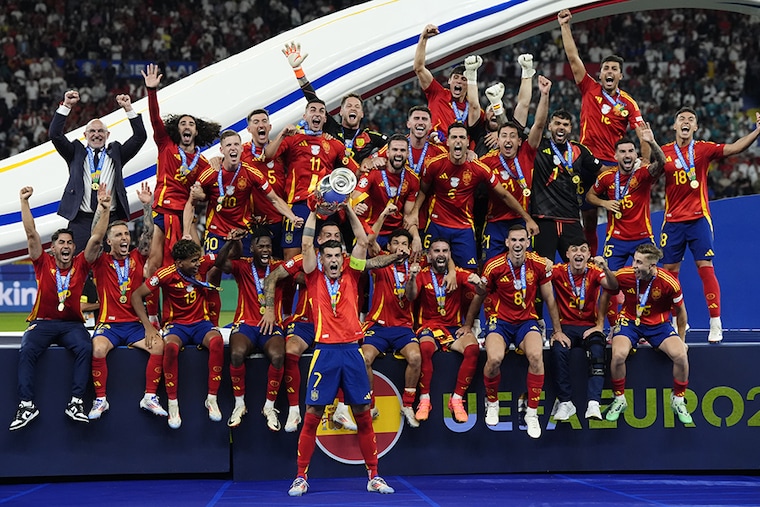 Spain"s Alvaro Morata lifts the Henri Delaunay Cup with teammates following victory against England after the UEFA Euro 2024 final match at the Olympiastadion, Berlin. July 14, 2024.