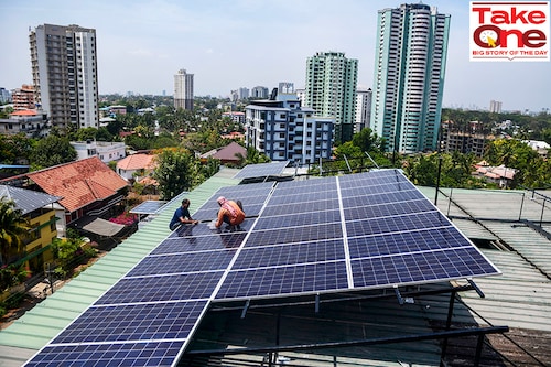 Workers install solar panels on the roof of a residential apartment in Kochi, southern Kerala state, India.
Image: AP Photo/R S Iyer