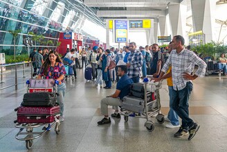 A general view of the Indira Gandhi International Airport as passengers gather and wait due to the global communications outage caused by CrowdStrike, which provides cyber security services to US technology company Microsoft, in New Delhi, India on July 19, 2024.