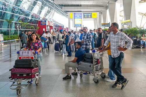 A general view of the Indira Gandhi International Airport as passengers gather and wait due to the global communications outage caused by CrowdStrike, which provides cyber security services to US technology company Microsoft, in New Delhi, India on July 19, 2024.