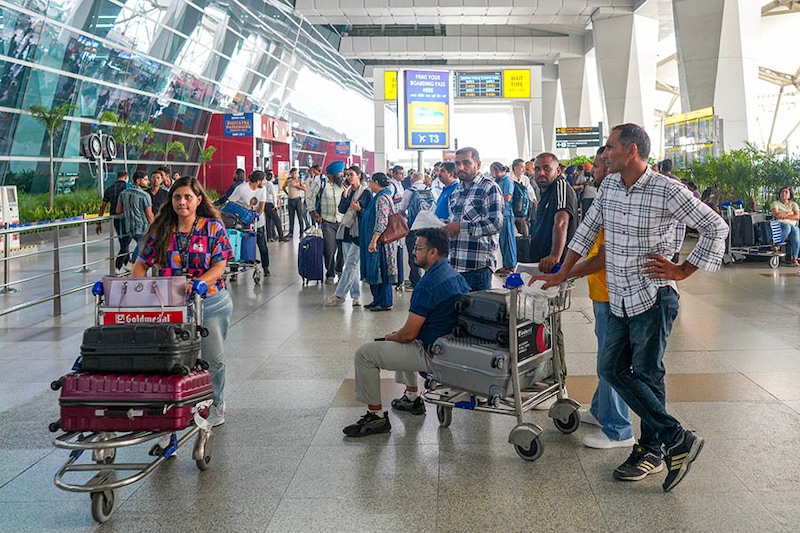 A general view of the Indira Gandhi International Airport as passengers gather and wait due to the global communications outage caused by CrowdStrike, which provides cyber security services to US technology company Microsoft, in New Delhi, India on July 19, 2024.