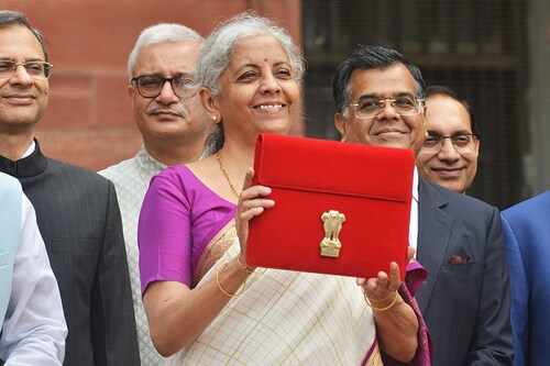 Indian Finance Minister Nirmala Sitharaman (C) holds a folder containing Union Budget documents outside the Ministry of Finance in New Delhi, India on July 23, 2024.
Image: Imtiyaz Khan/Anadolu via Getty Images
