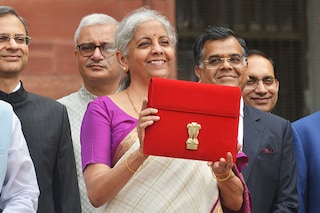 Indian Finance Minister Nirmala Sitharaman (C) holds a folder containing Union Budget documents outside the Ministry of Finance in New Delhi, India on July 23, 2024.
Image: Imtiyaz Khan/Anadolu via Getty Images