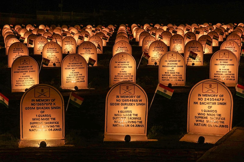A view shows the illuminated war memorial during the ""Vijay Diwas"" or Victory Day celebration in Drass, about 160 km (99 miles) east of Srinagar, Jammu and Kashmir, on July 25, 2024. PM Narendra Modi attended the 25th anniversary of Kargil Vijay Diwas on July 26. The Indian army commemorates ""Vijay Diwas"" annually in memory of more than 500 fellow soldiers who were killed during a war with Pakistan in the mountains of Kargil and Drass sectors at the Line of Control, or a military ceasefire line, which is dividing Kashmir between the two South Asian nuclear rivals.