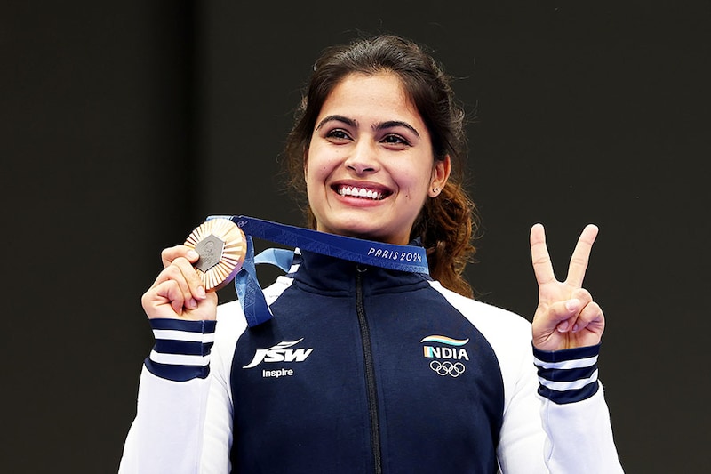 Bronze medallist Manu Bhaker of Team India poses on the podium during the Women"s 10m Air Pistol Final medal ceremony on day two of the Olympic Games Paris 2024 at Chateauroux Shooting Centre on July 28, 2024, in Chateauroux, France.