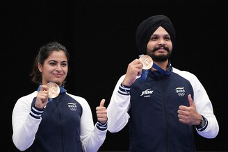 Bronze medallists for the 10m Air Pistol Mixed Team, Manu Bhaker and Sarabjot Singh (R) of India, pose with their medals at Chateauroux Shooting Centre, Deols, France on July 30, 2024.