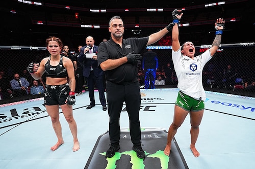 Puja Tomar of India reacts after her victory against Rayanne dos Santos of Brazil in a strawweight fight during the UFC Fight Night event at KFC YUM! Center on June 08, 2024 in Louisville, Kentucky.
Image: Jeff Bottari/Zuffa LLC via Getty Images Puja Tomar of India reacts after her victory against Rayanne dos Santos of Brazil in a strawweight fight during the UFC Fight Night event at KFC YUM! Center on June 08, 2024 in Louisville, Kentucky.
Image: Jeff Bottari/Zuffa LLC via Getty Images