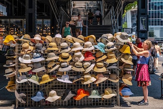 A vendor sells summer hats in Manhattan on a sweltering afternoon on the first full day of summer on June 21, 2024 in New York City. New York City and much of the Northeast is experiencing higher than usual temperatures as a heat wave blankets the area, causing the heat index to feel over 100 degrees in many states. Meteorologists are predicting that this could be one of the hottest summers on record.