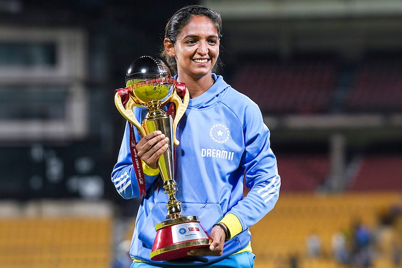 India"s captain Harmanpreet Kaur poses with trophy after India won the third women"s ODI cricket match and series over South Africa, at M Chinnaswamy Stadium in Bengaluru, Sunday, June 23, 2024.