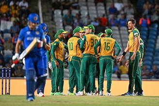 South Africa"s players celebrate after Afghanistan"s Rahmanullah Gurbaz (L) is run out during the 2024 ICC Men"s T20 World Cup semi-final match between South Africa and Afghanistan at Brian Lara Cricket Academy in Tarouba, Trinidad and Tobago, on June 26, 2024.