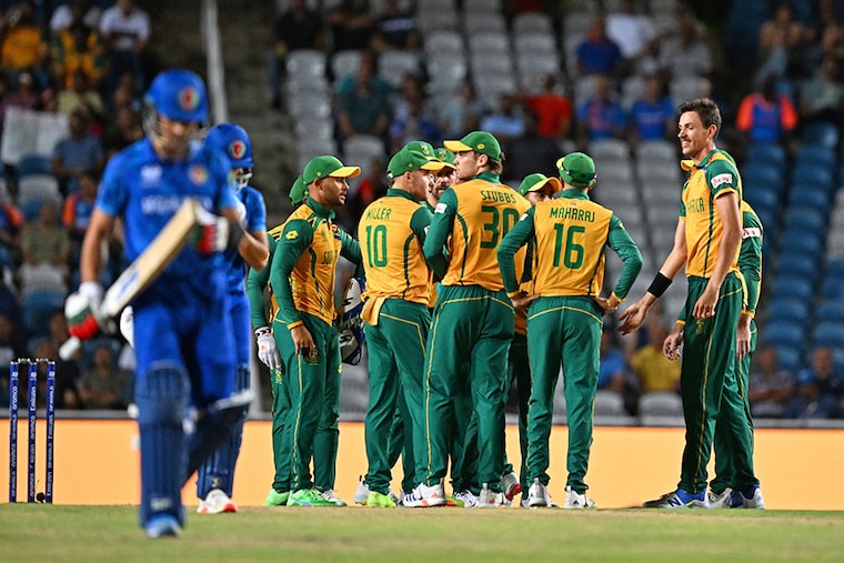 South Africa"s players celebrate after Afghanistan"s Rahmanullah Gurbaz (L) is run out during the 2024 ICC Men"s T20 World Cup semi-final match between South Africa and Afghanistan at Brian Lara Cricket Academy in Tarouba, Trinidad and Tobago, on June 26, 2024.