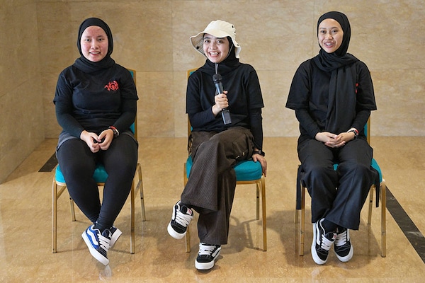Members of the Indonesian metal band Voice of Baceprot (VOB) vocalist and guitarist Firda Kurnia (C), bassist Widi Rahmawati (R), and drummer Euis Siti Aisah (L)
Image: Bay Ismoyo / AFPÂ©
