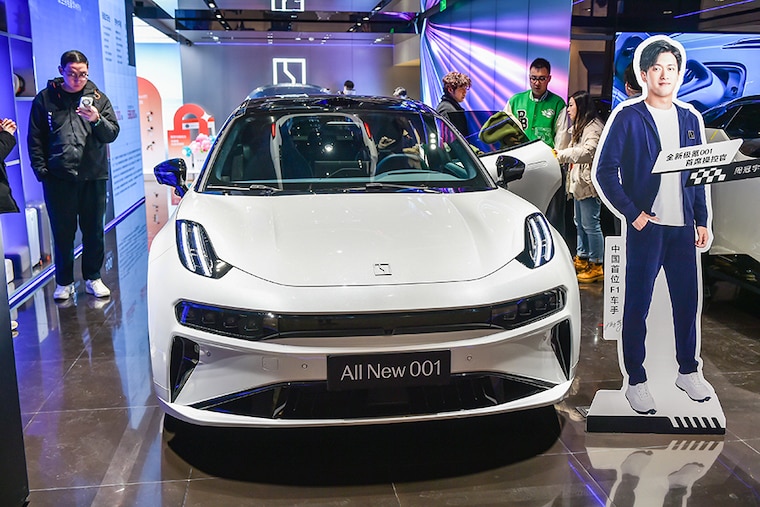 Consumers shop for new energy vehicles at a ZEEKR store in Nanjing, Jiangsu province, China, on March 9, 2024. On March 8, 2024, the latest data released by the Passenger Federation showed that the retail volume of the domestic passenger car market in February was 1.095 million, down 21 percent year-on-year and 46.2 percent month-on-month. Image: CFOTO/Future Publishing via Getty Images