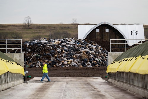 A worker walks past piles of collected leaves at the New York City Department of Sanitation (DSNY) Staten Island Compost Facility.
Image: Angela Weiss / AFP© A worker walks past piles of collected leaves at the New York City Department of Sanitation (DSNY) Staten Island Compost Facility.
Image: Angela Weiss / AFP©