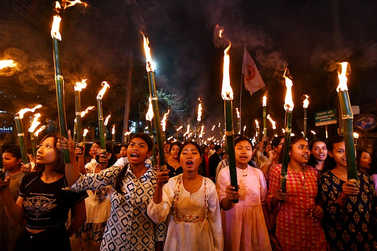 Members of the All Assam Students" Union (AASU) take part in a torch rally on March 12, 2024, to protest the implementation of the Citizenship Amendment Act (CAA) in Guwahati. India"s interior ministry said on March 11 that it was enacting a citizenship law just weeks before the world"s most populous country heads into a general election.