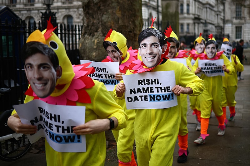 Activists from Britain"s main opposition Labour Party pose for a photograph dressed in chicken suits wearing masks of Britain"s Prime Minister, Rishi Sunak, to encourage him to call a General Election, in central London, on March 15, 2024. On Thursday, Sunak ruled out calling the election on May 2 to coincide with local polls. He could wait until January 2025 to go to the country but has said his "working assumption" is the vote will be in the second half of the year.