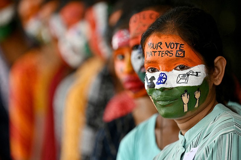 College students with painted faces spread awareness among first-generation voters during an election campaign, ahead of India"s upcoming national elections, in Chennai on March 19, 2024.