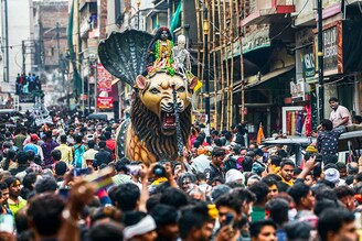Hindu devotees take part in a religious procession on the occasion of "Masaan" or "Bhasma" Holi, which is celebrated with ashes of funeral pyres, in Varanasi on March 20, 2024.