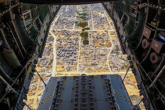 This handout image released by Spain"s Ministry of Defence and Ministry of Foreign Affairs, European Union and Cooperation on March 27, 2024 shows an A400 military aircraft releasing parachutes with 26 tons, 11,000 rations of food, as part of humanitarian aid over the Gaza Strip.