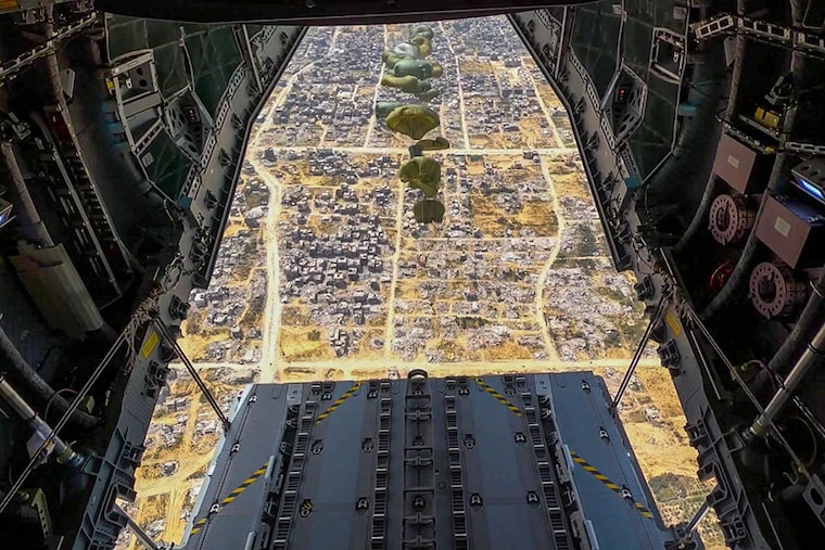 This handout image released by Spain"s Ministry of Defence and Ministry of Foreign Affairs, European Union and Cooperation on March 27, 2024 shows an A400 military aircraft releasing parachutes with 26 tons, 11,000 rations of food, as part of humanitarian aid over the Gaza Strip.