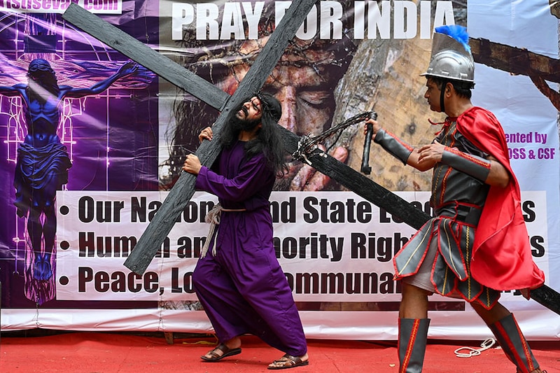 Christians devotees re-enact the crucifixion of Jesus Christ during a Good Friday procession in Mumbai on March 29, 2024.