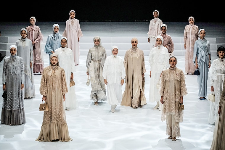 Indonesian designer Ayu Dyah Andari (C) walks with models presenting her creations during the Indonesia Fashion Week at the Jakarta Convention Center in Jakarta on March 29, 2024.