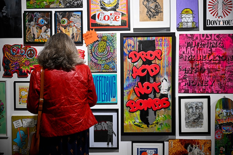 Artwork is displayed at the Revolting Artists exhibition on March 29, 2024 in Weymouth, England. The "Revolting Artists" event, themed "Hope - The Underdog Winning," features leading UK urban and subversive artists showcasing "subvertising", "brandalism", satirical art, street photography, counter-culture cinema, and graffiti work with appearances by wildlife TV presenter Chris Packham and Chumbawamba founding member Dunstan Bruce.