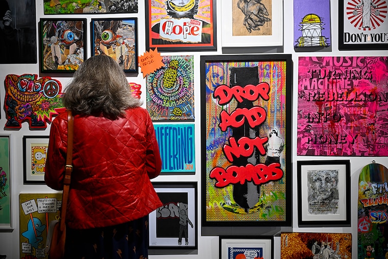 Artwork is displayed at the Revolting Artists exhibition on March 29, 2024 in Weymouth, England. The "Revolting Artists" event, themed "Hope - The Underdog Winning," features leading UK urban and subversive artists showcasing "subvertising", "brandalism", satirical art, street photography, counter-culture cinema, and graffiti work with appearances by wildlife TV presenter Chris Packham and Chumbawamba founding member Dunstan Bruce.