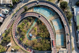The Bangkok Metropolitan Authority operates around 40 parks, but intends to double that number by adding flora to small disused plots hemmed in by motorways or high-rise buildings. Image credit: Photography Manan VATSYAYANA / AFP