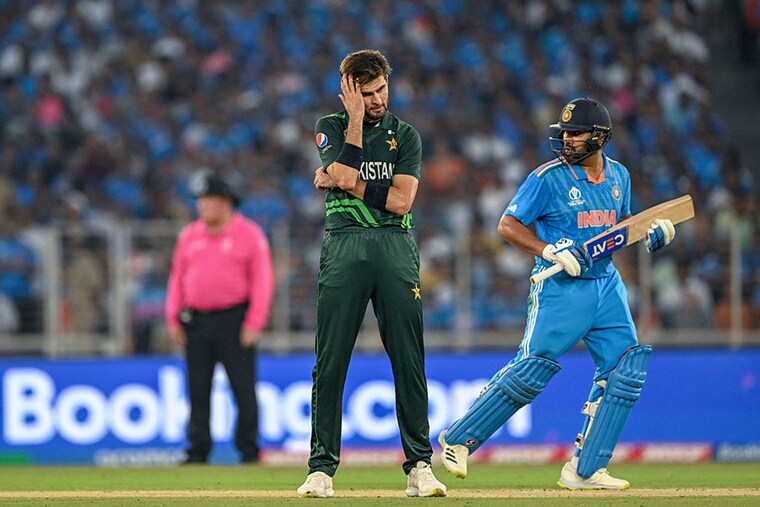 Pakistan"s Shaheen Shah Afridi (L) gestures as India"s captain Rohit Sharma runs between the wickets during the 2023 ICC Men"s Cricket World Cup one-day international (ODI) match between India and Pakistan at the Narendra Modi Stadium in Ahmedabad on October 14, 2023. Image credit: Punit PARANJPE / AFP