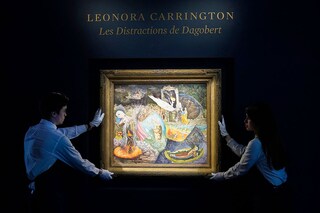 Sotheby’s art handlers hold Leonora Carrington"s “Les Distractions de Dagobert" during a media preview for Sotheby"s upcoming "New York Marquee Evening Sales" on May 3, 2024, in New York City. Image credit: Photography TIMOTHY A. CLARY / AFP©