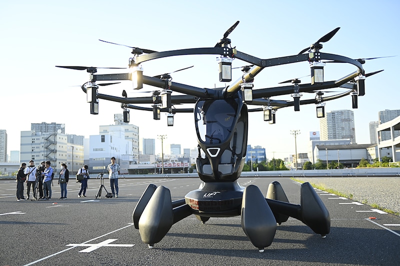Members of media are seen covering the first demonstration flight on Friday May 17, 2024, in Tokyo, Japan, of HEXA, the new generation flying car from the American company LIFT aircraft based in Japan and developed by Marubeni Aerospace.