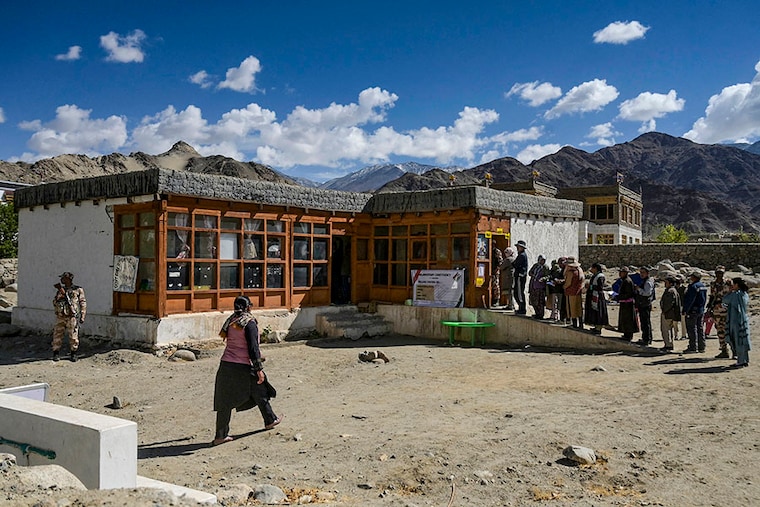 Voters queue to cast their ballots at a polling station during the fifth phase of voting in India"s general election in Thiksey, a village in the Leh district of Ladakh, on May 20, 2024. India"s election is conducted in seven phases over six weeks to ease the immense logistical burden of staging the democratic exercise in the world"s most populous country.