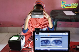 Who is watching?: A woman takes an iris scan to link her Aadhaar card with the National Register of Citizens (NRC) during a hearing at a Passport Seva Kendra (PSK) in Barpeta district in Assam
Image: David Talukadar / AFP