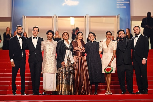 (FromL) Indian co-producer Ranabir Das, French producer Julien Graff, Indian actor Hridhu Haroon, Indian actress Chhaya Kadam, Indian actress Divya Prabha, Indian director Payal Kapadia, Indian actress Kani Kusruti, Indian co-producer Zico Maitra and French producer Thomas Hakim arrive for the screening of the film "All We Imagine as Light" at the 77th edition of the Cannes Film Festival in Cannes, southern France, on May 23, 2024. (Photo by LOIC VENANCE / AFP) (FromL) Indian co-producer Ranabir Das, French producer Julien Graff, Indian actor Hridhu Haroon, Indian actress Chhaya Kadam, Indian actress Divya Prabha, Indian director Payal Kapadia, Indian actress Kani Kusruti, Indian co-producer Zico Maitra and French producer Thomas Hakim arrive for the screening of the film "All We Imagine as Light" at the 77th edition of the Cannes Film Festival in Cannes, southern France, on May 23, 2024. (Photo by LOIC VENANCE / AFP)