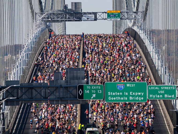 In this aerial view, runners compete as they cross over the Verrazzano-Narrows Bridge during the 2024 TCS New York City Marathon on November 03, 2024, in New York City.