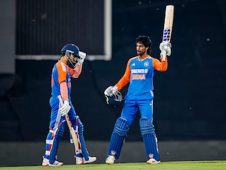 India"s Tilak Varma (R) celebrates after scoring a century (100 runs) as India"s Ramandeep Singh (L) looks on during the third T20 international cricket match between South Africa and India at SuperSport Park in Centurion on November 13, 2024.