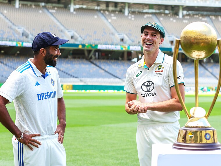 Jasprit Bumrah of India and Pat Cummins of Australia share a moment with the Border-Gavaskar Trophy during a media opportunity ahead of the series" First Test Match between Australia and India at Optus Stadium on November 21, 2024 in Perth, Australia.