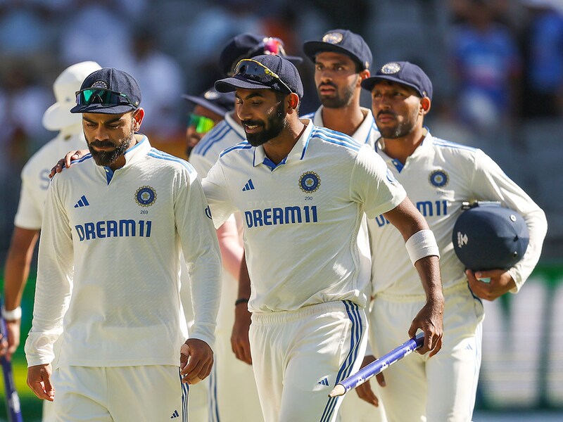 Virat Kohli and Jasprit Bumrah of India celebrate the wicket of Alex Carey of Australia and winning the match during day four of the First Test match in the series between Australia and India at Perth Stadium on November 25, 2024 in Perth, Australia.
