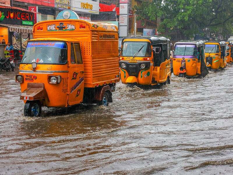Vehicles move through a flooded street amid rains in Chennai on Tuesday, November 26, 2024. The India Meteorological Department said the depression over the Bay of Bengal is likely to intensify into a deep depression.