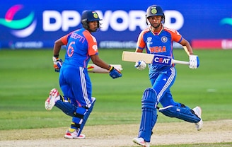 India"s captain Harmanpreet Kaur (R) and her teammate Deepti Sharma take a run during the ICC Women"s T20 World Cup cricket match between Pakistan and India at the Dubai International Cricket Stadium in Dubai on October 6, 2024. India beat Pakistan by six wickets.