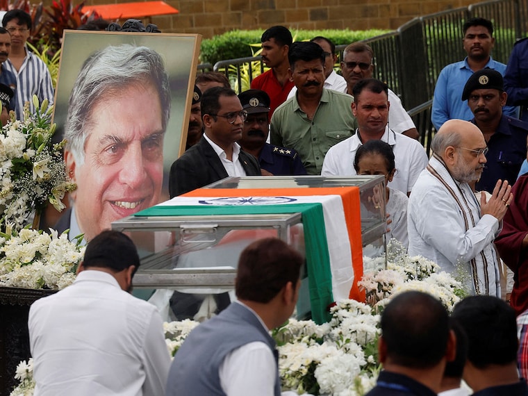 India"s Home Minister Amit Shah pays his last respect to Indian industrialist Ratan Tata at the National Centre for the Performing Arts (NCPA) ahead of Tata"s cremation in Mumbai on October 10, 2024. Crowds of mourners gathered in India"s financial capital Mumbai on October 10 for the funeral of Ratan Tata, hailed as a "titan" who led one of the country"s biggest conglomerates.
