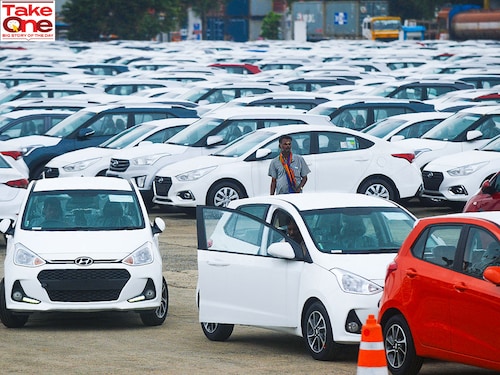 (File) A worker inspects parked Hyundai vehicles ready for shipment at a port in Chennai.
Image: Arun Sankar / AFP (File) A worker inspects parked Hyundai vehicles ready for shipment at a port in Chennai.
Image: Arun Sankar / AFP