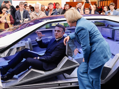 French President Emmanuel Macron sits aboard a Peugeot Inception concept car as he visits the Stellantis stand at the Paris Motor Show at Paris Expo Porte de Versailles in Paris on October 14, 2024
Image: Ludovic Marin Pool / AFP© French President Emmanuel Macron sits aboard a Peugeot Inception concept car as he visits the Stellantis stand at the Paris Motor Show at Paris Expo Porte de Versailles in Paris on October 14, 2024
Image: Ludovic Marin Pool / AFP©