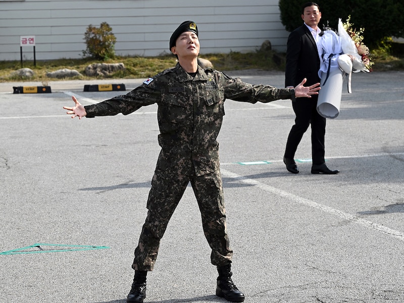 BTS member J-hope reacts after being discharged from his mandatory military service outside a military base in Wonju on October 17, 2024.